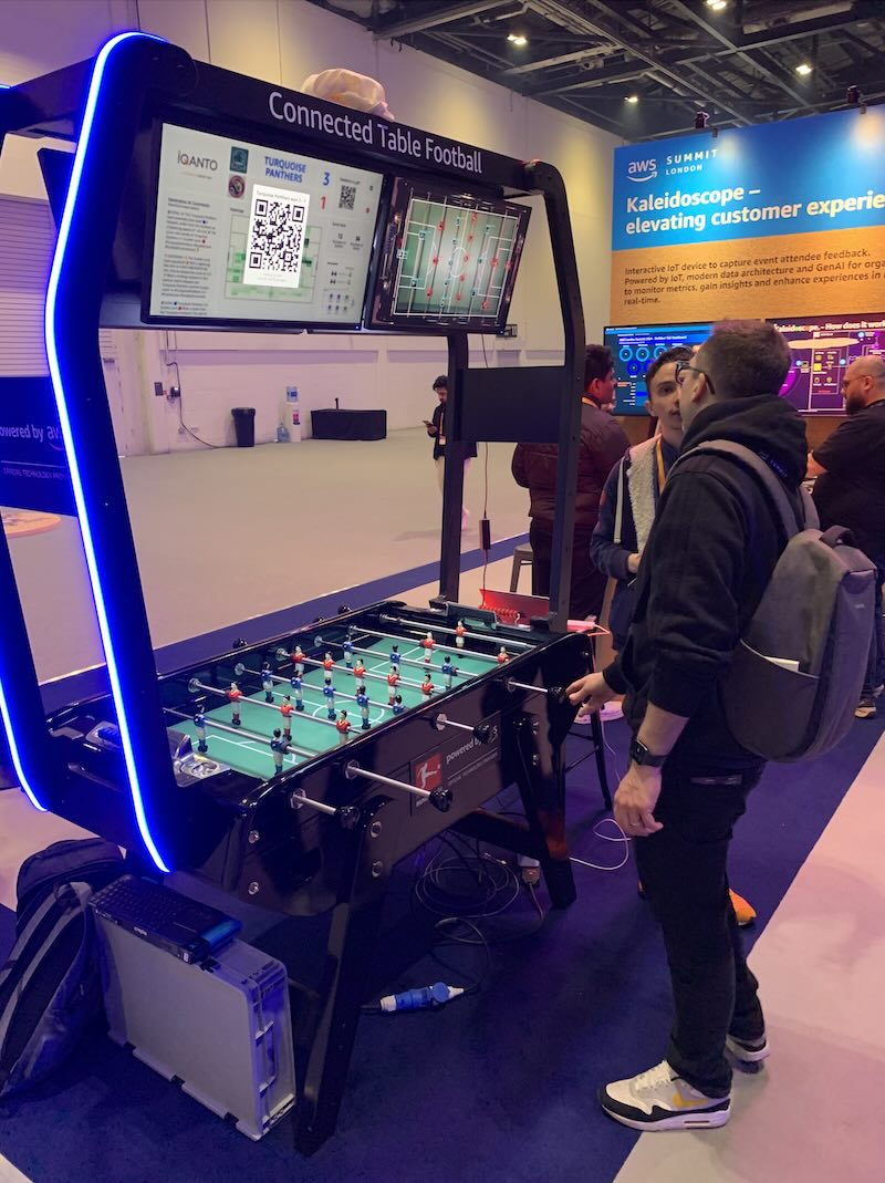 Photo taken at AWS Summit London 2024, Martin Hicks of Si Novi talking to the developer of the AWS Connected Table Football