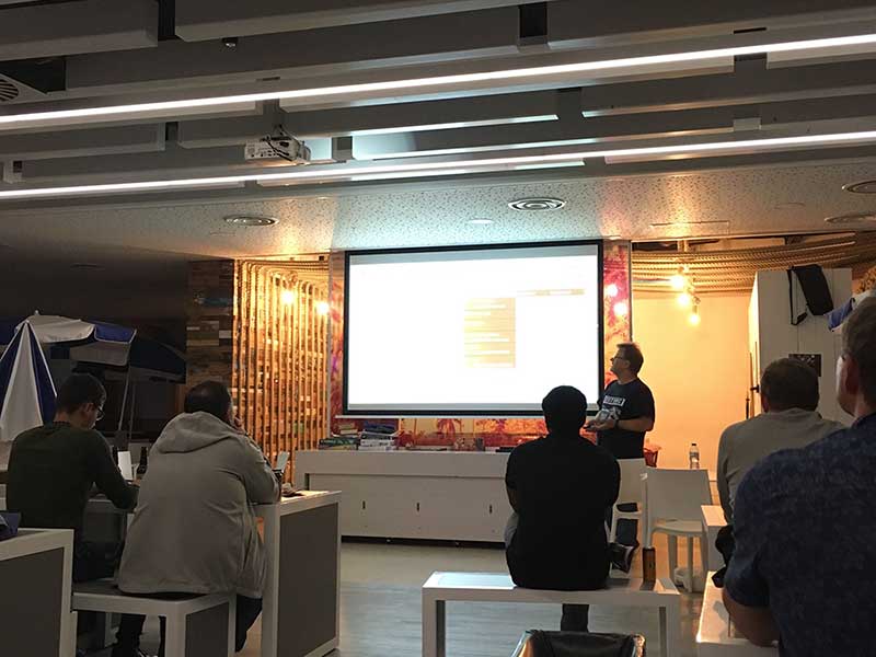 Photo from the audience at AWS User Group North September 2019 Meetup; a speaker is presenting their talk.