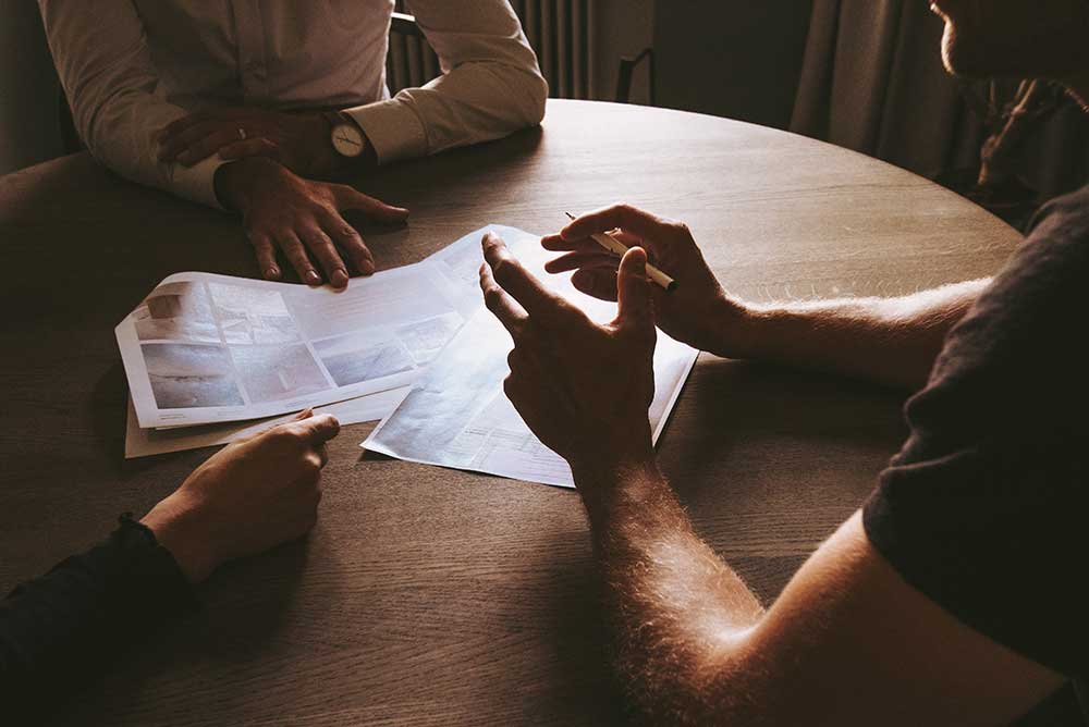 People sat around a table discussing ideas