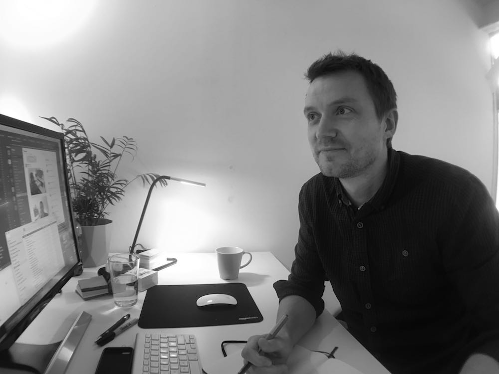 James Galley, sat working at his computer. Photo taken forward facing.